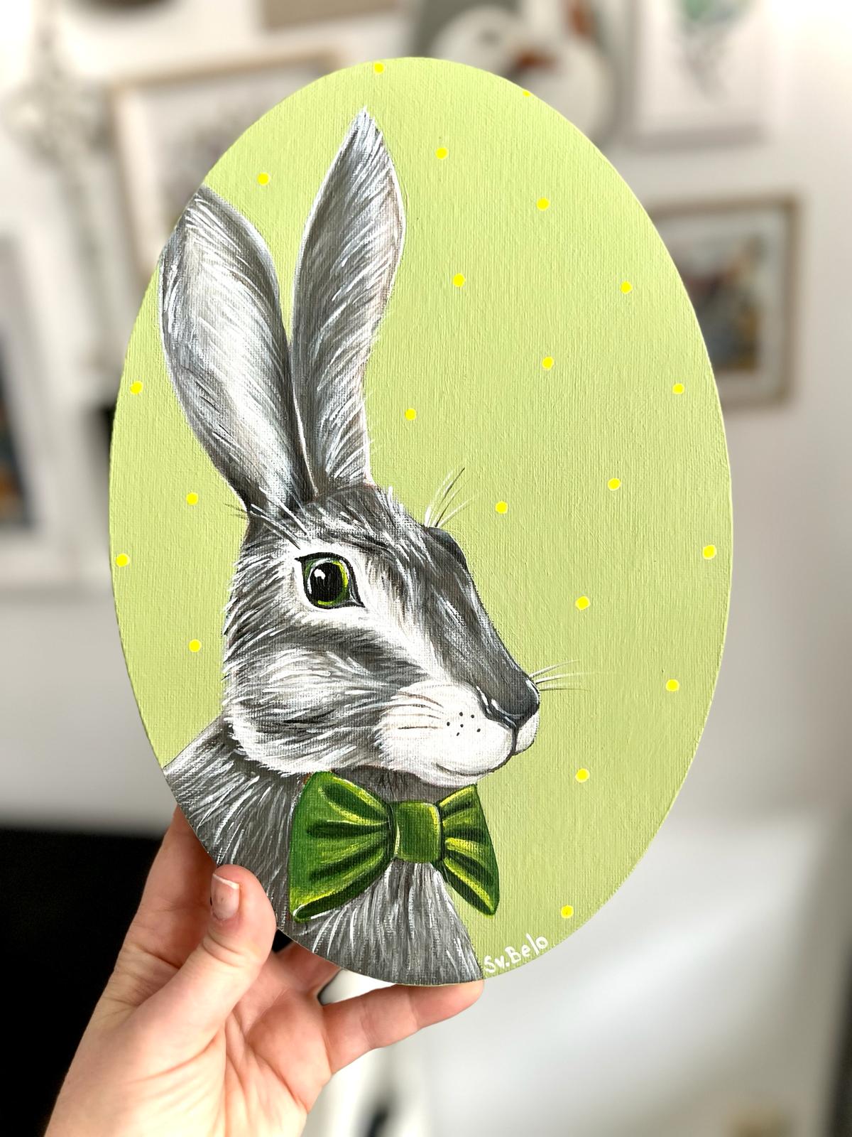 Gray hare with dark green bow tie. Acrylic painting on canvas, oval, 20*30 cm. Gift idea, wall decoration, country house decor.