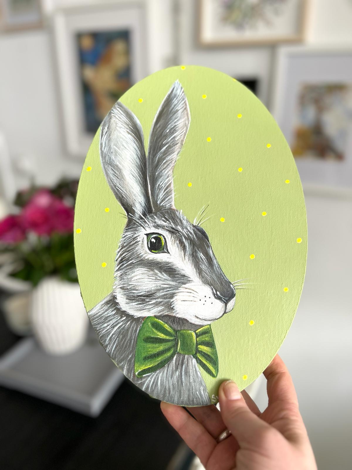 Gray hare with dark green bow tie. Acrylic painting on canvas, oval, 20*30 cm. Gift idea, wall decoration, country house decor.