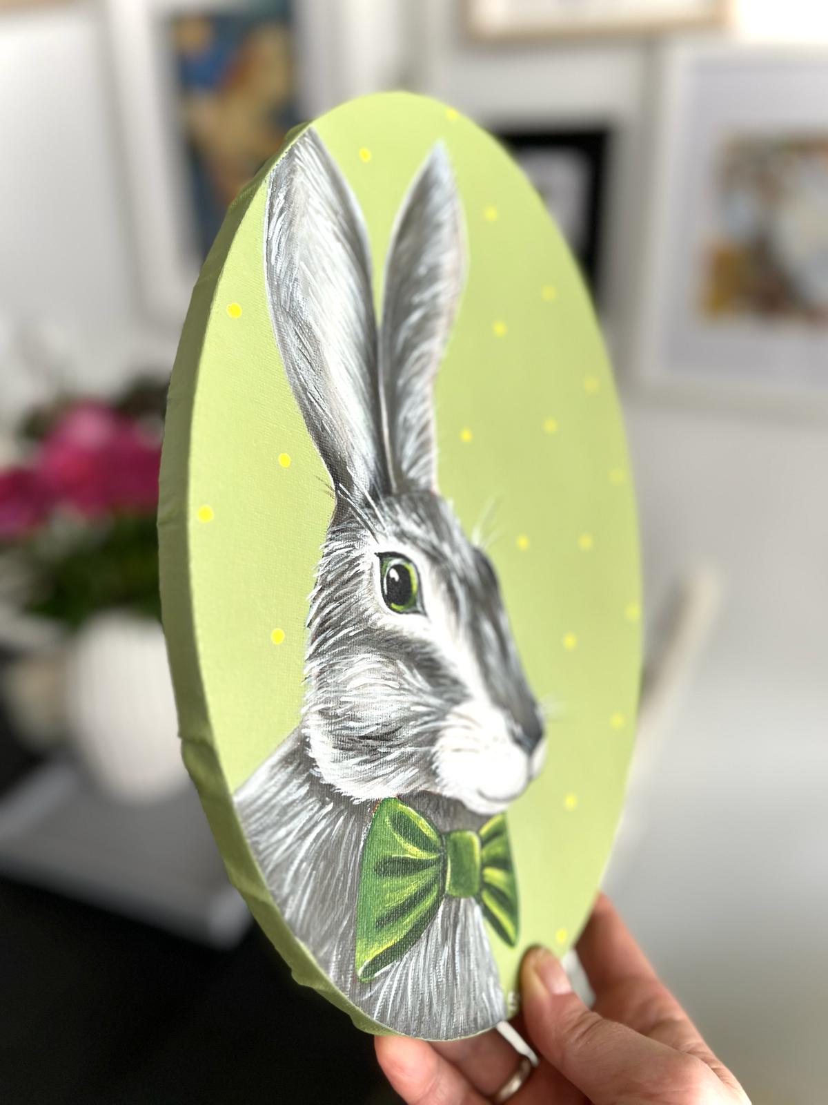 Gray hare with dark green bow tie. Acrylic painting on canvas, oval, 20*30 cm. Gift idea, wall decoration, country house decor.