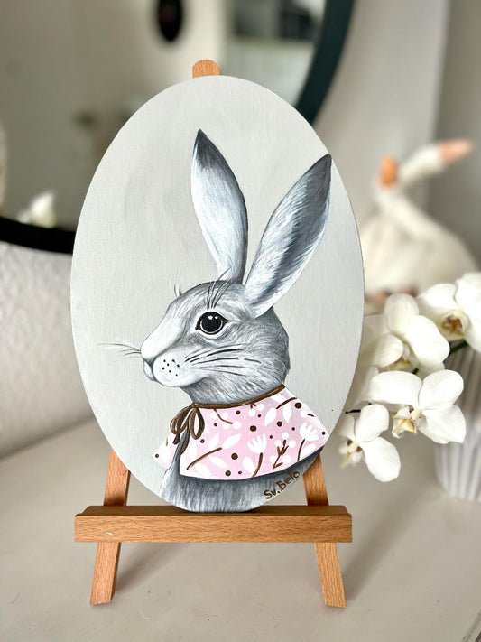 A gray rabbit with a pink collar. Acrylic painting on canvas, oval, 20*30 cm. Gift idea, wall decoration, country house decor.