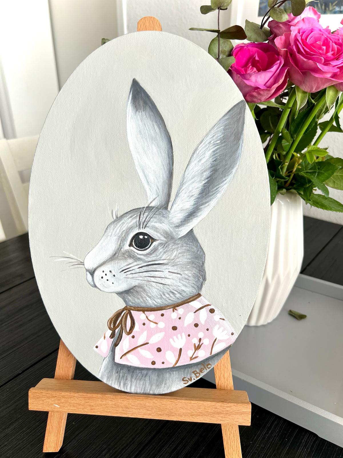 A gray rabbit with a pink collar. Acrylic painting on canvas, oval, 20*30 cm. Gift idea, wall decoration, country house decor.