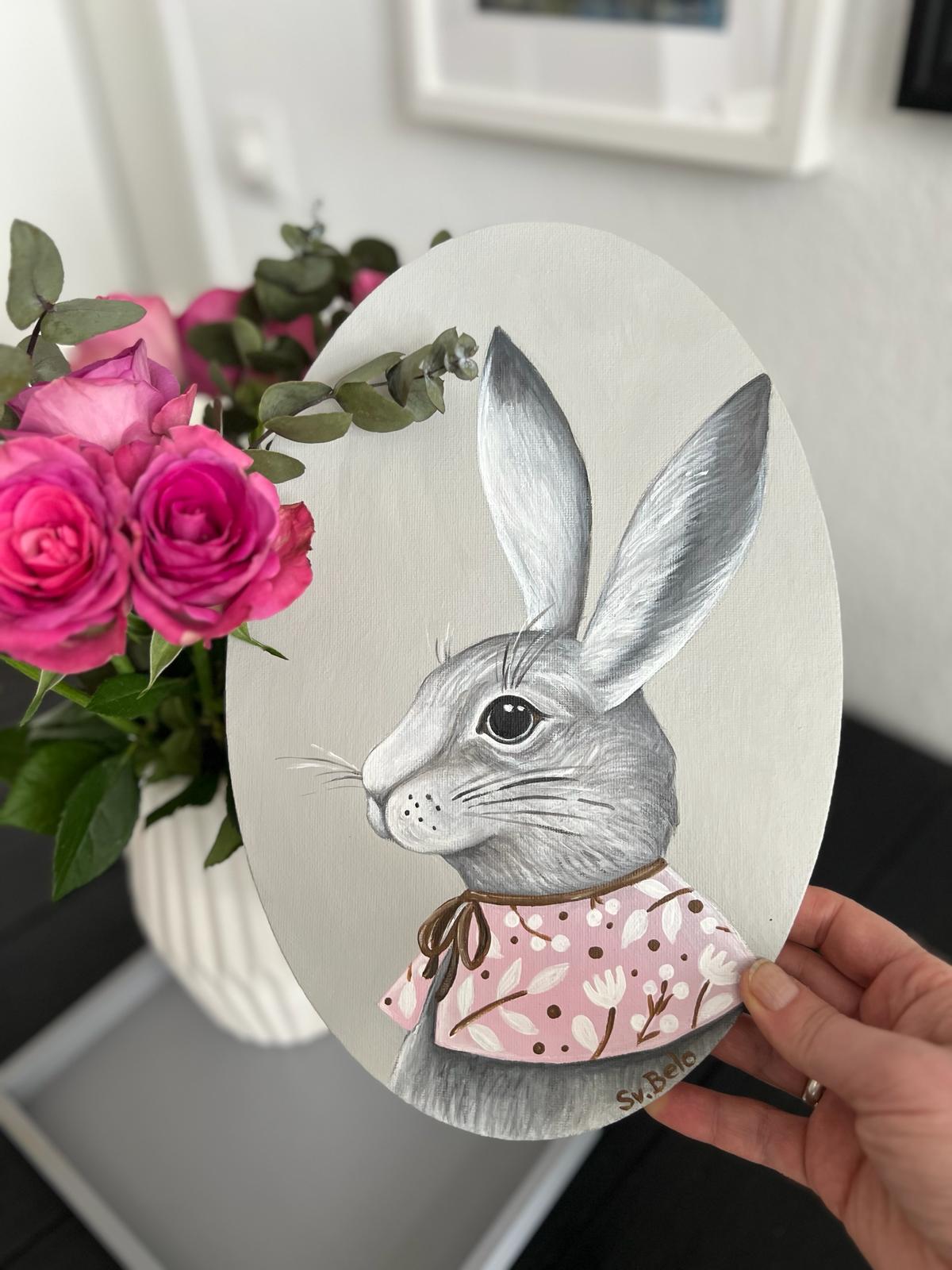 A gray rabbit with a pink collar. Acrylic painting on canvas, oval, 20*30 cm. Gift idea, wall decoration, country house decor.