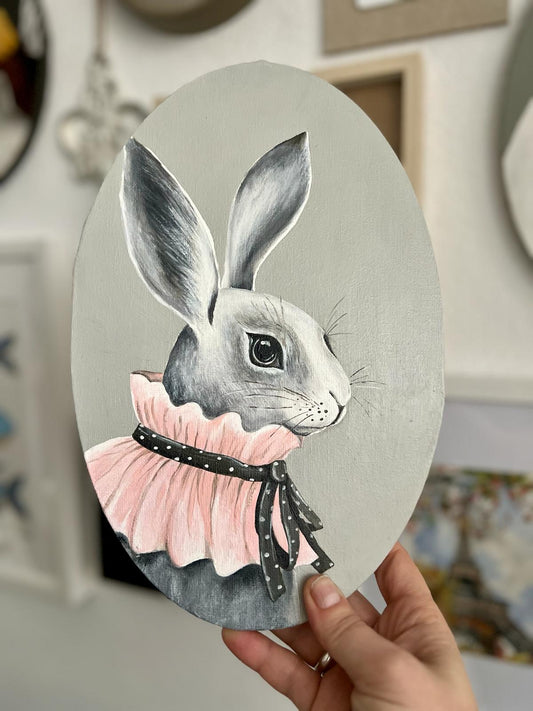 Looking forward to Easter. A gray rabbit with a pink collar. Acrylic painting on canvas, oval, 20*30 cm, gift idea, wall decoration, country house decor.