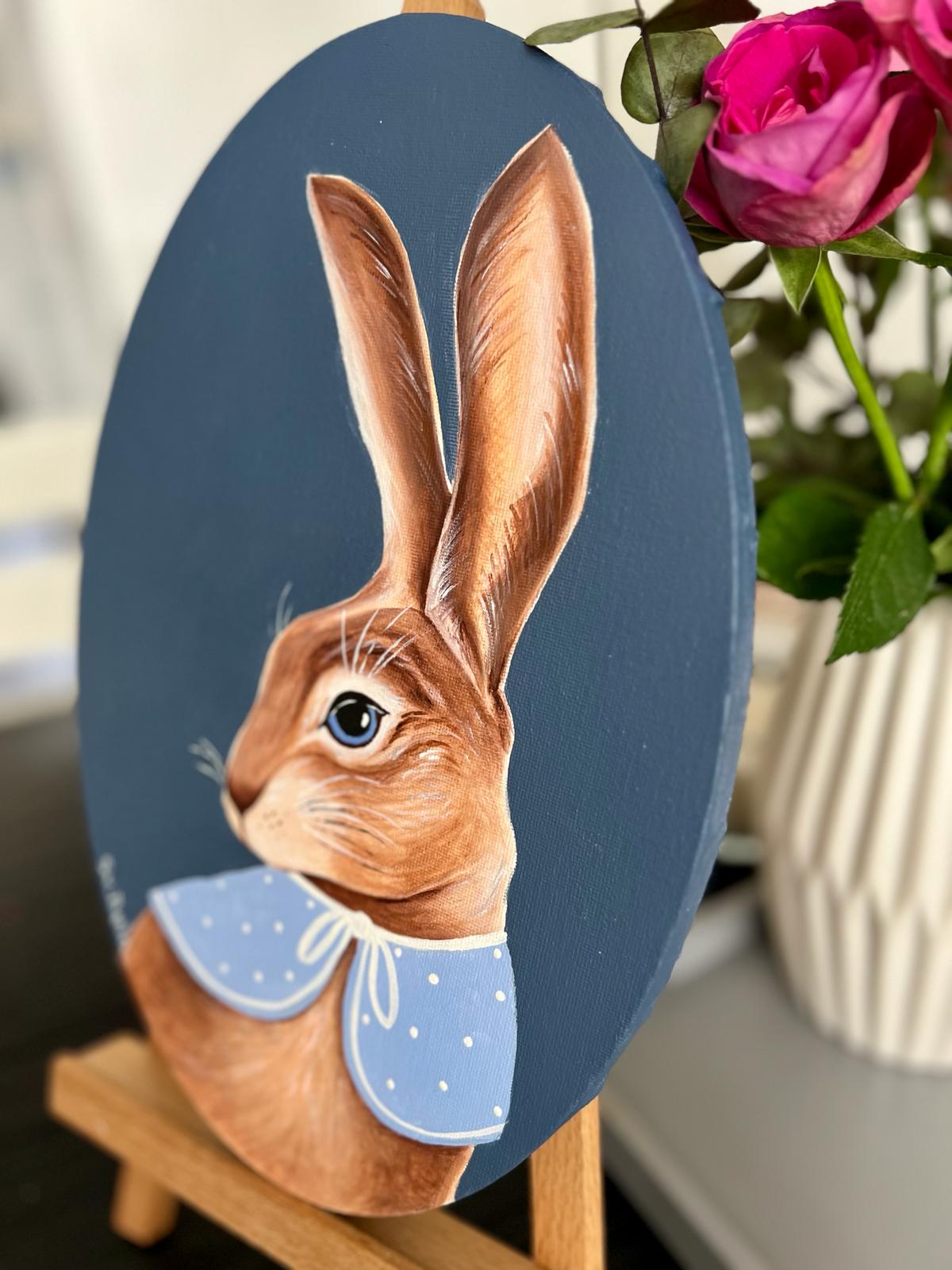 Easter Bunny. Brown rabbit on dark blue background with blue collar. Acrylic painting on canvas, oval, 20*30 cm, gift idea, wall decoration, country house decor.